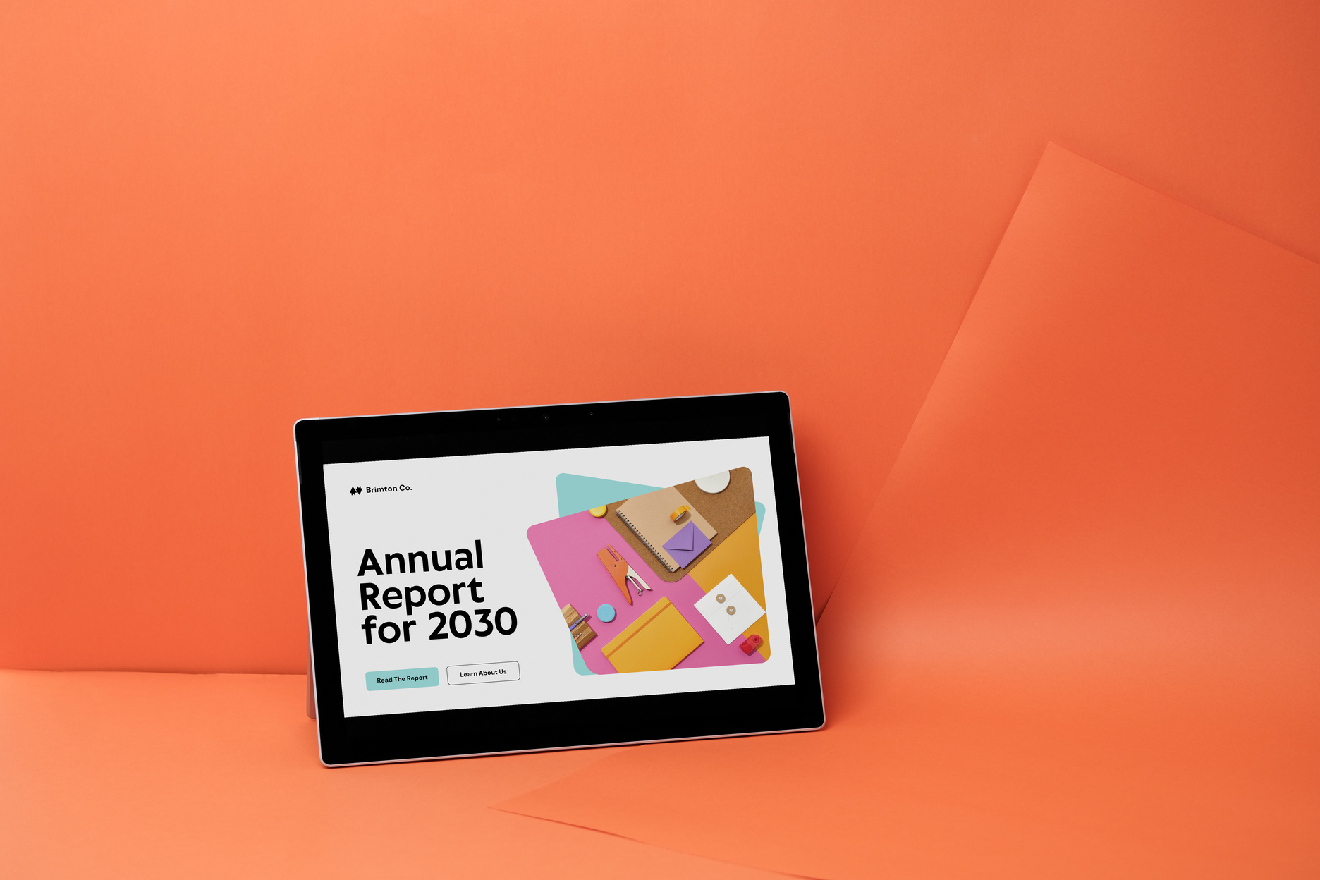 Annual Report Mockup on Tablet on Orange Background
